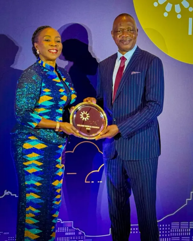 Adeniyi receiving award